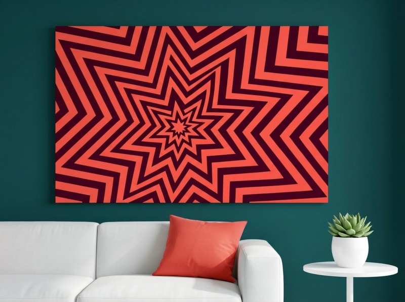 Geometric starburst canvas print in coral red concentric circles, bold 70s Op Art style