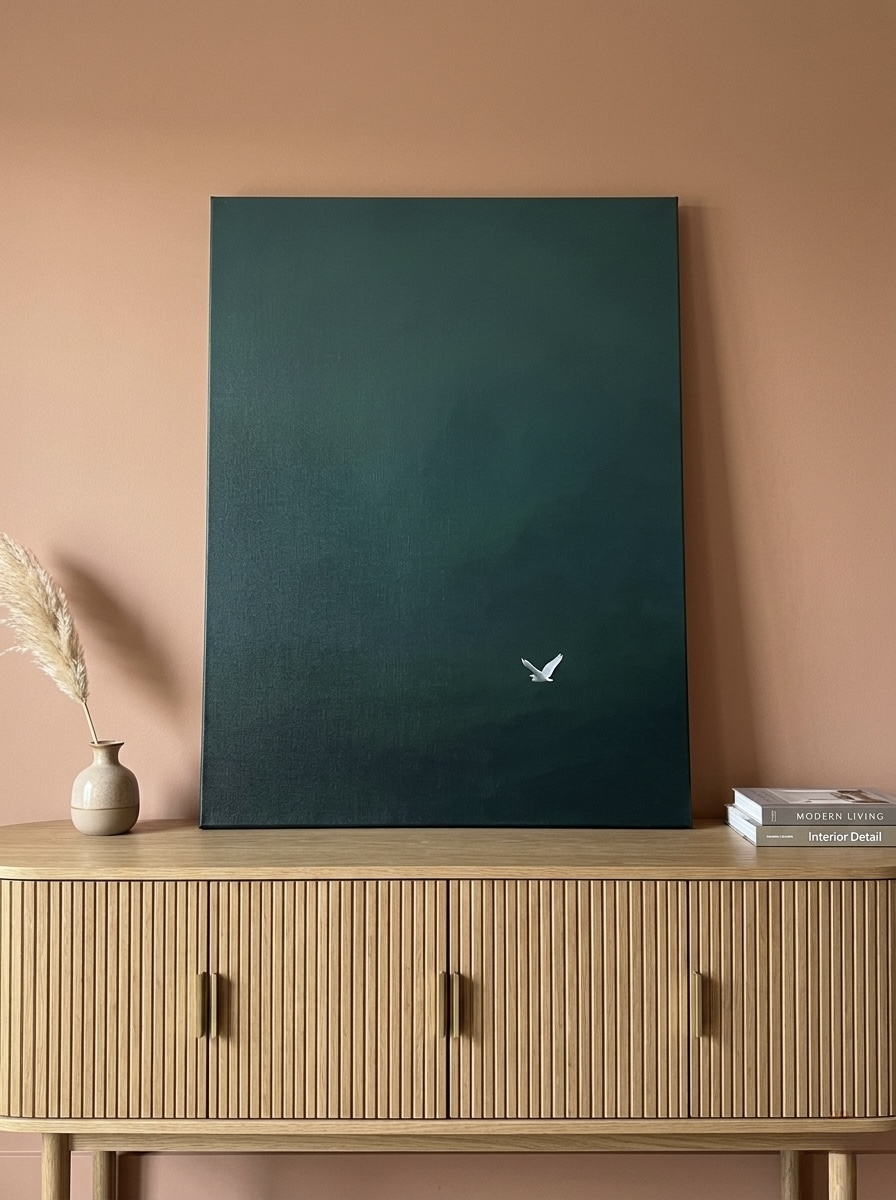 White egret silhouette on a deep teal background, minimalist canvas styled above a coastal bedroom dresser